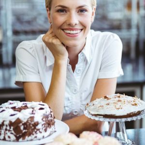 happy-pretty-woman-preparing-plate-of-cake.jpg